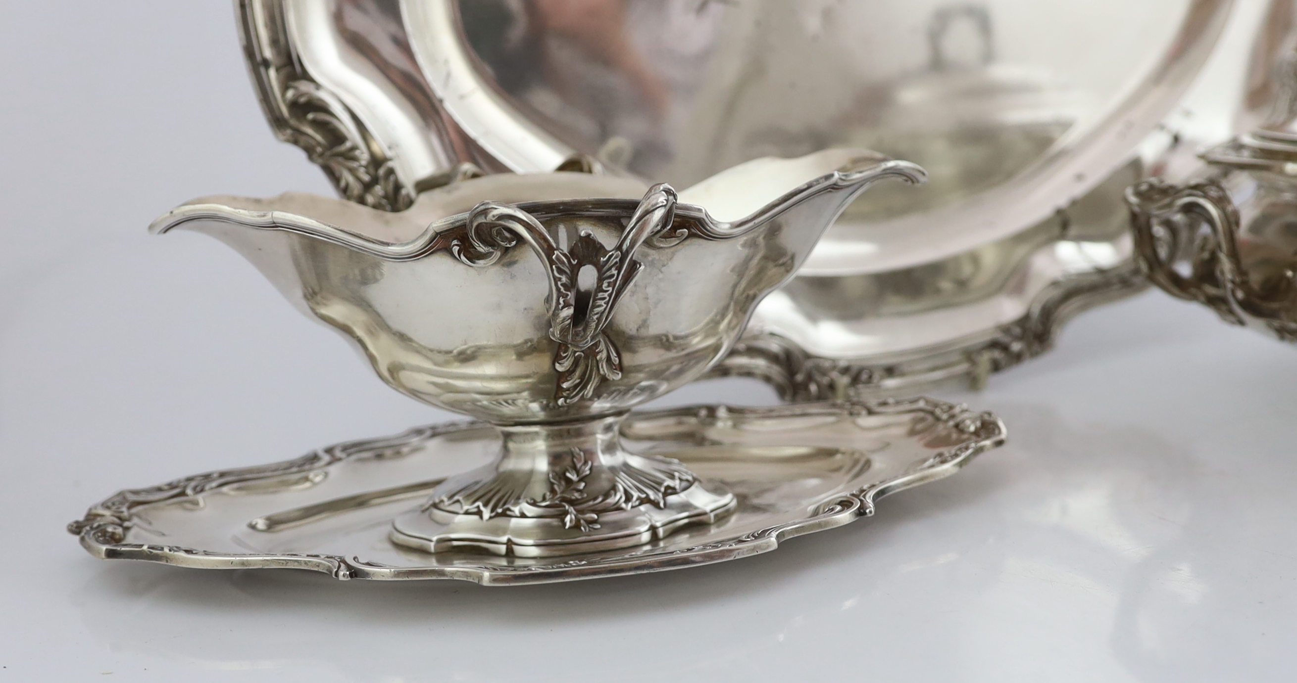 A late 19th century French 950 standard silver tureen and cover, a sauceboat on fixed stand and two serving dishes, by V. Boivin, Paris